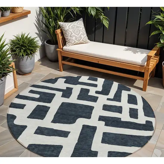 8' Black And Ivory Round Abstract Washable Indoor Outdoor Area Rug Photo 1
