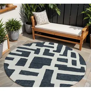 Photo of 8' Black And Ivory Round Abstract Washable Indoor Outdoor Area Rug