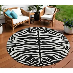 Photo of 8' Black And Ivory Round Animal Print Washable Indoor Outdoor Area Rug