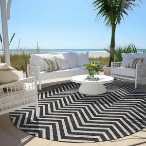 Photo of 8' Black And Ivory Round Chevron Washable Indoor Outdoor Area Rug