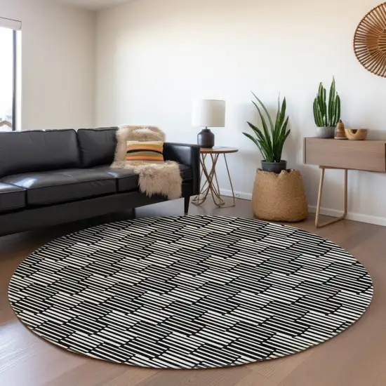 8' Black And Ivory Round Geometric Washable Indoor Outdoor Area Rug Photo 7