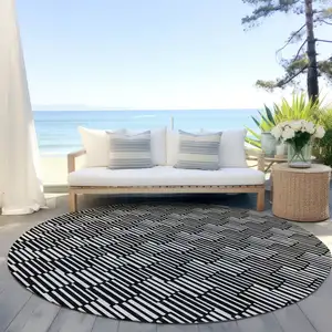 Photo of 8' Black And Ivory Round Geometric Washable Indoor Outdoor Area Rug