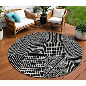 Photo of 8' Black And Ivory Round Geometric Washable Indoor Outdoor Area Rug