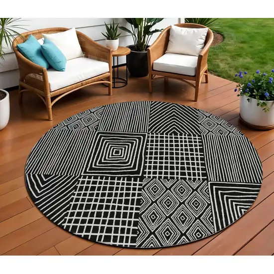 8' Black And Ivory Round Geometric Washable Indoor Outdoor Area Rug Photo 1