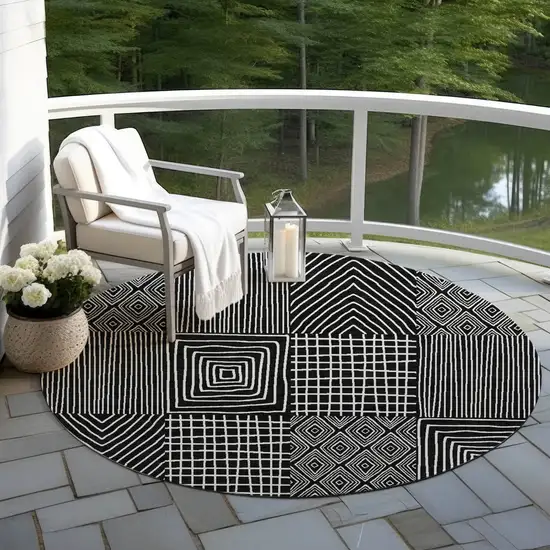 8' Black And Ivory Round Geometric Washable Indoor Outdoor Area Rug Photo 7