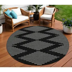 Photo of 8' Black And Ivory Round Geometric Washable Indoor Outdoor Area Rug