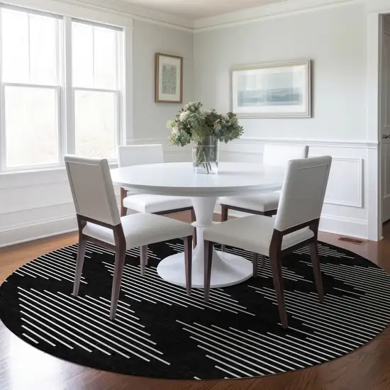 8' Black And Ivory Round Geometric Washable Indoor Outdoor Area Rug Photo 8