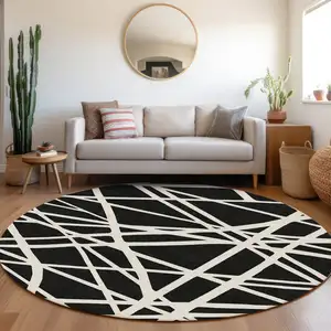 Photo of 8' Black And Ivory Round Geometric Washable Indoor Outdoor Area Rug
