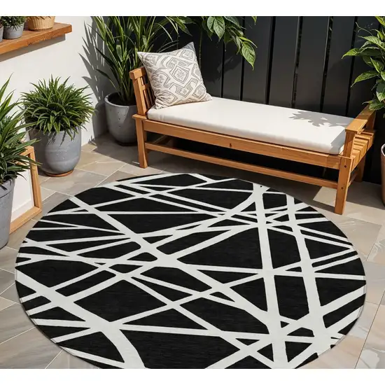 8' Black And Ivory Round Geometric Washable Indoor Outdoor Area Rug Photo 1