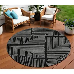 Photo of 8' Black And Ivory Round Geometric Washable Indoor Outdoor Area Rug