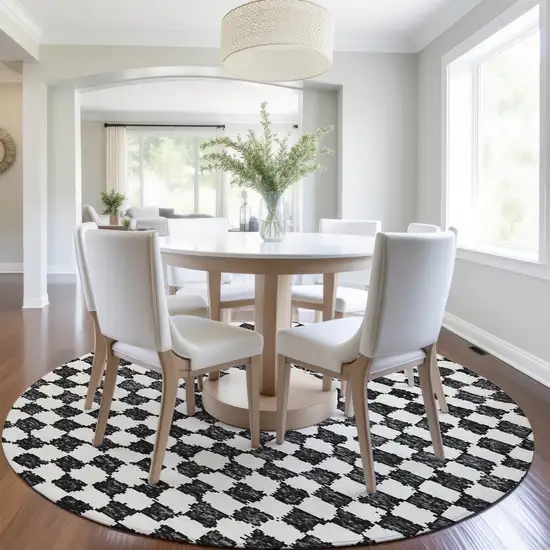 8' Black And Ivory Round Geometric Washable Indoor Outdoor Area Rug Photo 6