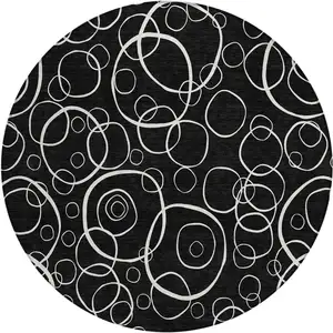 Photo of 8' Black And Ivory Round Geometric Washable Indoor Outdoor Area Rug