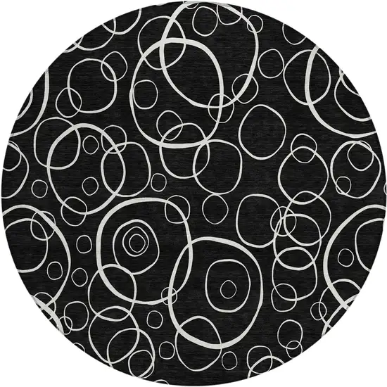 8' Black And Ivory Round Geometric Washable Indoor Outdoor Area Rug Photo 1