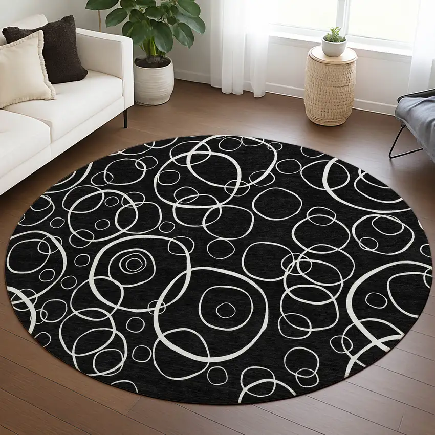 8' Black And Ivory Round Geometric Washable Indoor Outdoor Area Rug Photo 5