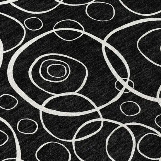 8' Black And Ivory Round Geometric Washable Indoor Outdoor Area Rug Photo 9