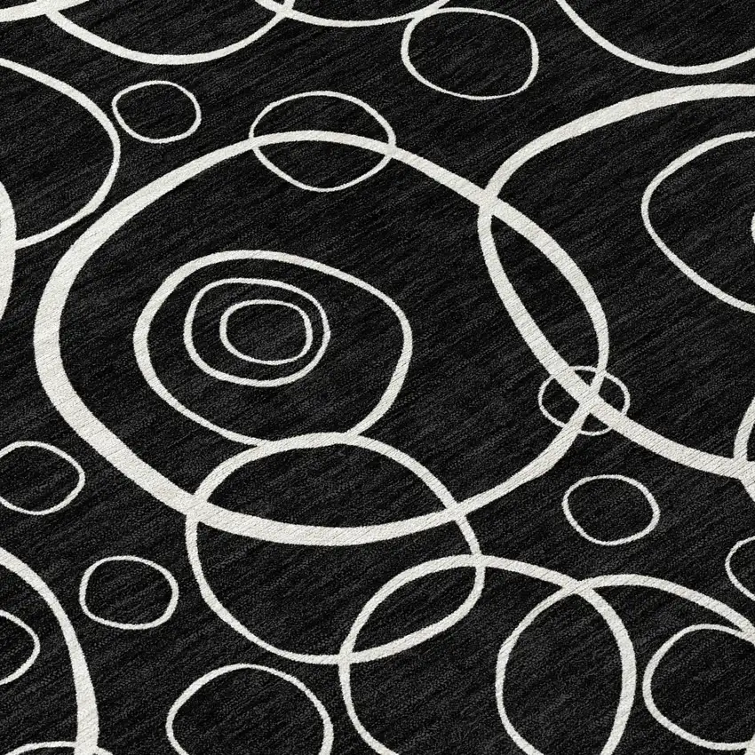 8' Black And Ivory Round Geometric Washable Indoor Outdoor Area Rug Photo 9