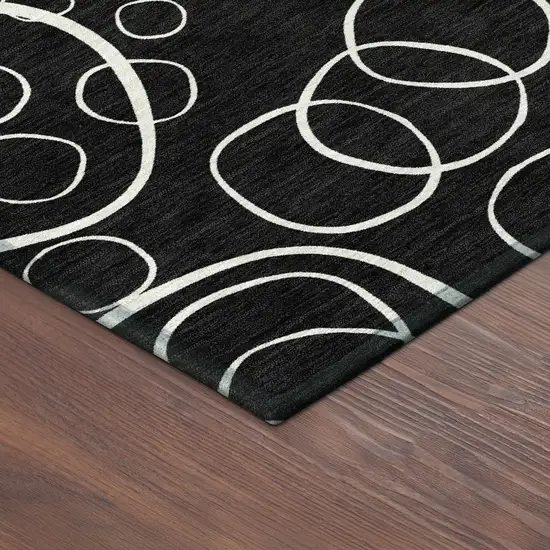8' Black And Ivory Round Geometric Washable Indoor Outdoor Area Rug Photo 8