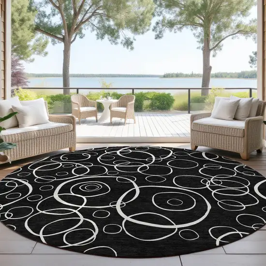 8' Black And Ivory Round Geometric Washable Indoor Outdoor Area Rug Photo 4
