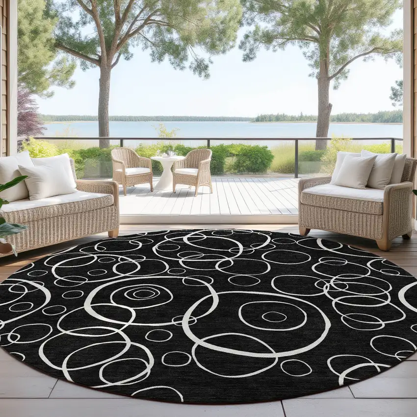 8' Black And Ivory Round Geometric Washable Indoor Outdoor Area Rug Photo 4