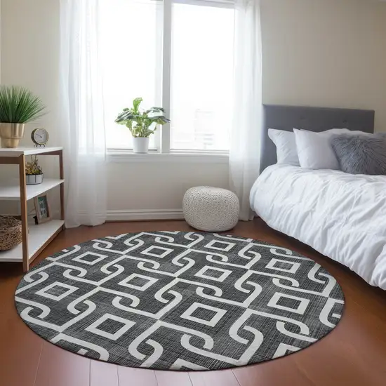 8' Black And Ivory Round Geometric Washable Indoor Outdoor Area Rug Photo 7