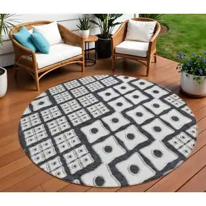 Photo of 8' Black And Ivory Round Geometric Washable Indoor Outdoor Area Rug