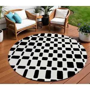 Photo of 8' Black And Ivory Round Geometric Washable Indoor Outdoor Area Rug