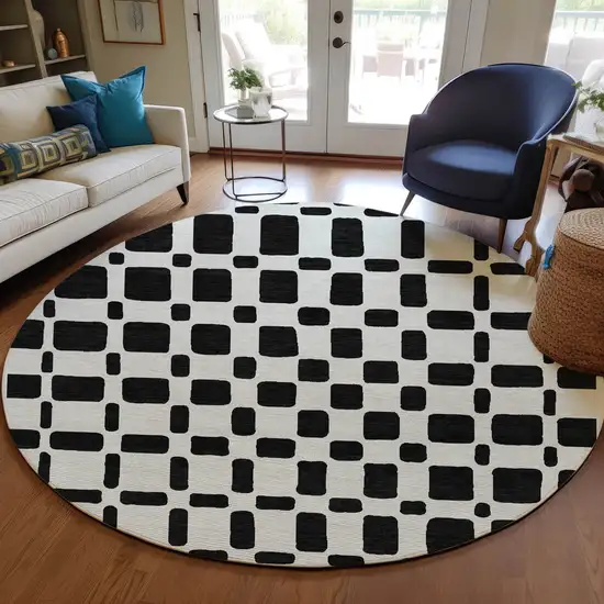 8' Black And Ivory Round Geometric Washable Indoor Outdoor Area Rug Photo 7