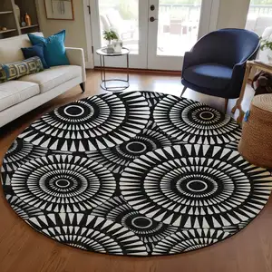 Photo of 8' Black And Ivory Round Geometric Washable Indoor Outdoor Area Rug