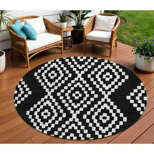 Photo of 8' Black And Ivory Round Geometric Washable Indoor Outdoor Area Rug