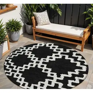 Photo of 8' Black And Ivory Round Geometric Washable Indoor Outdoor Area Rug