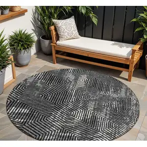 Photo of 8' Black And Ivory Round Geometric Washable Indoor Outdoor Area Rug
