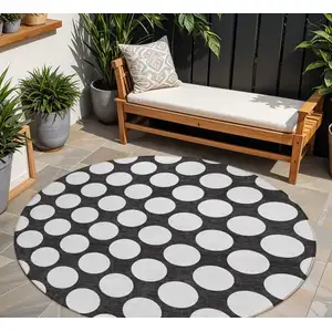 Photo of 8' Black And Ivory Round Polka Dot Washable Indoor Outdoor Area Rug