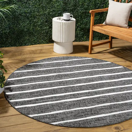 8' Black And Ivory Round Striped Indoor Outdoor Area Rug Photo 5