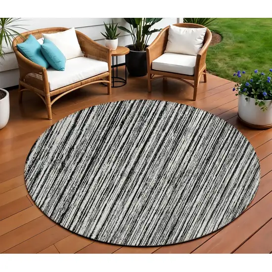 8' Black And Ivory Round Striped Washable Indoor Outdoor Area Rug Photo 1