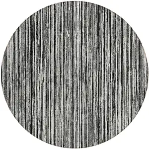 Photo of 8' Black And Ivory Round Striped Washable Indoor Outdoor Area Rug