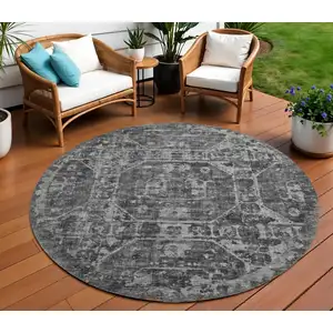 Photo of 8' Black And Ivory Round Tribal Washable Indoor Outdoor Area Rug