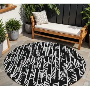 Photo of 8' Black And Ivory Round Tribal Washable Indoor Outdoor Area Rug