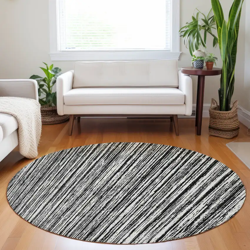 8' Black And Ivory Striped Washable Round Rug With UV Protection Photo 5