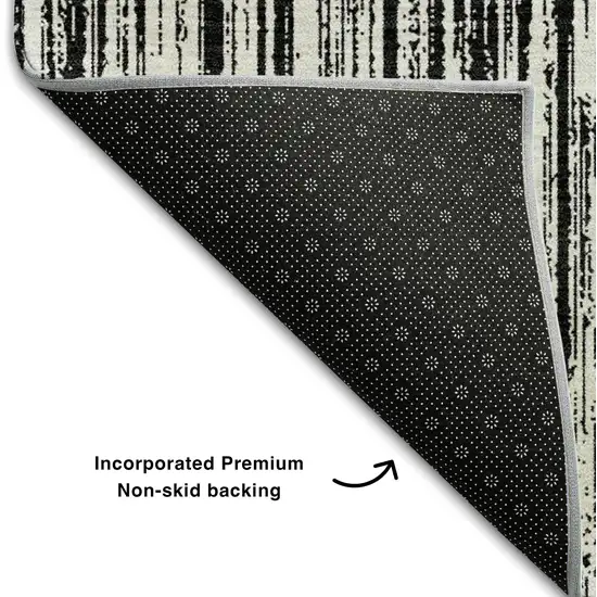 8' Black And Ivory Striped Washable Round Rug With UV Protection Photo 6