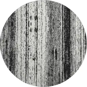 Photo of 8' Black And Ivory Striped Washable Round Rug With UV Protection