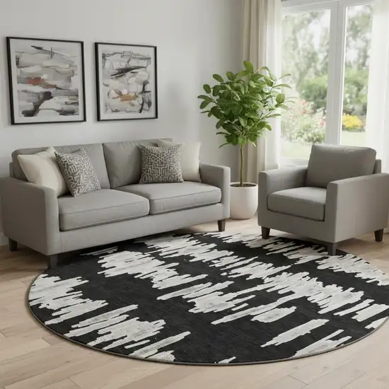 8' Black And Ivory Striped Washable Round Rug With UV Protection Photo 1