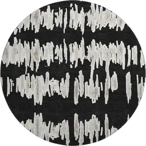 Photo of 8' Black And Ivory Striped Washable Round Rug With UV Protection