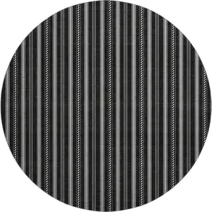 Photo of 8' Black And Ivory Striped Washable Round Rug With UV Protection