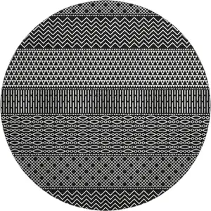 Photo of 8' Black And Ivory Striped Washable Round Rug With UV Protection