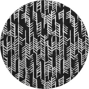 Photo of 8' Black And Ivory Tribal Washable Round Rug With UV Protection