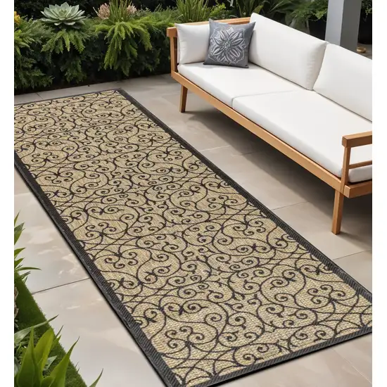 8' Black And Khaki Geometric Indoor Outdoor Runner Rug Photo 1