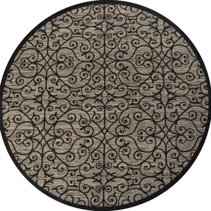 Photo of 9' Black And Khaki Round Geometric Indoor Outdoor Area Rug