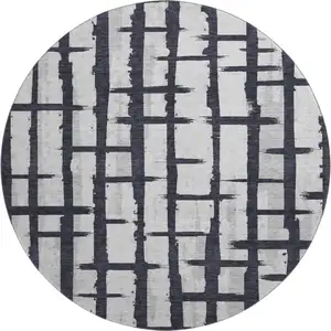 Photo of 8' Black And Silver Striped Washable Round Rug With UV Protection