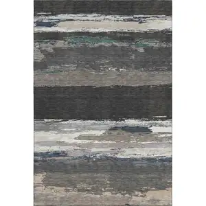 Photo of 8' Black Beige And Blue Abstract Washable Area Rug With UV Protection