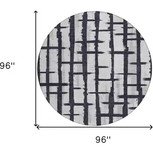 Photo of 8' Black Beige And Gray Round Striped Washable Indoor Outdoor Area Rug